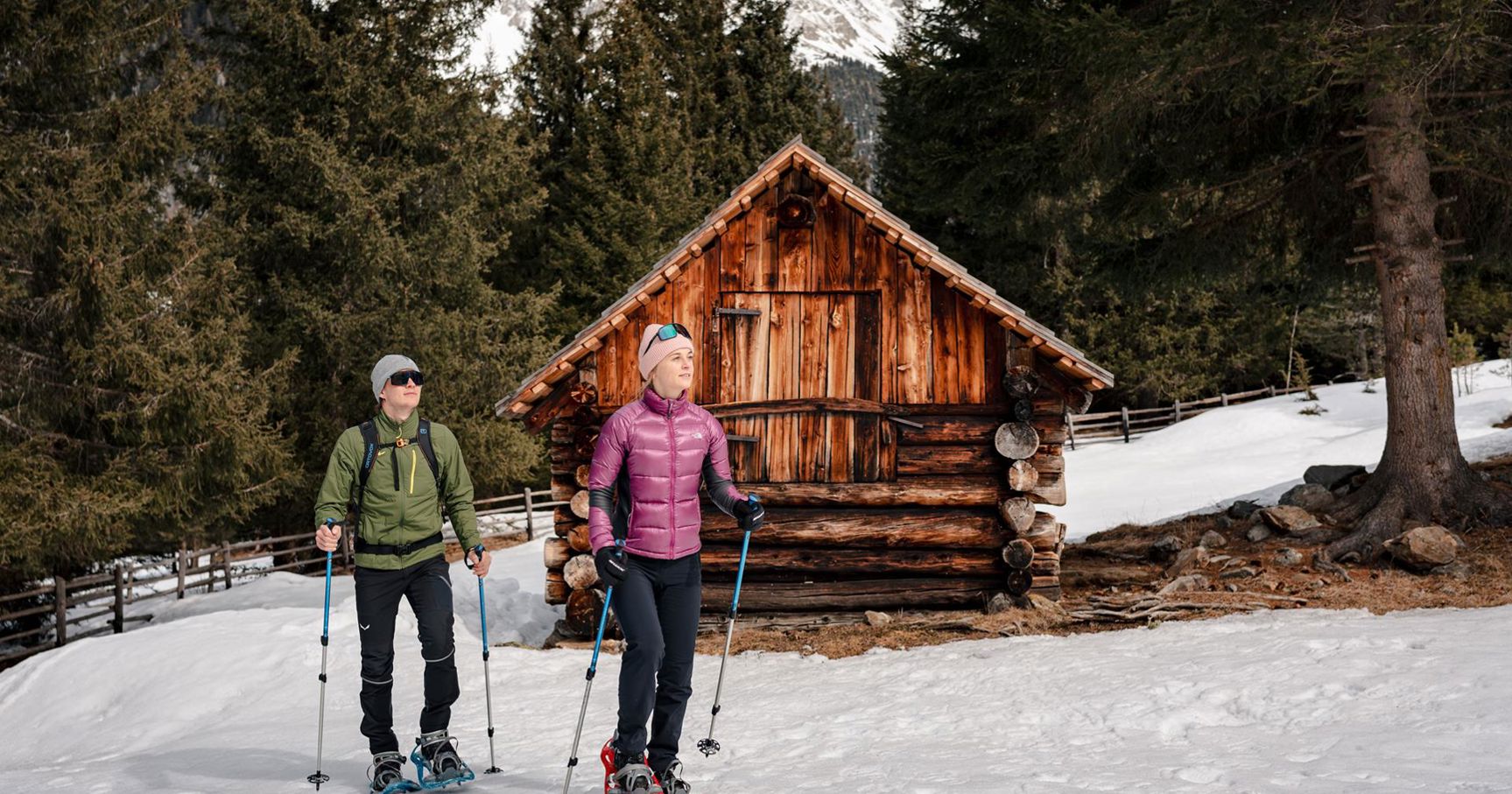 Two people on a snowshoe hike